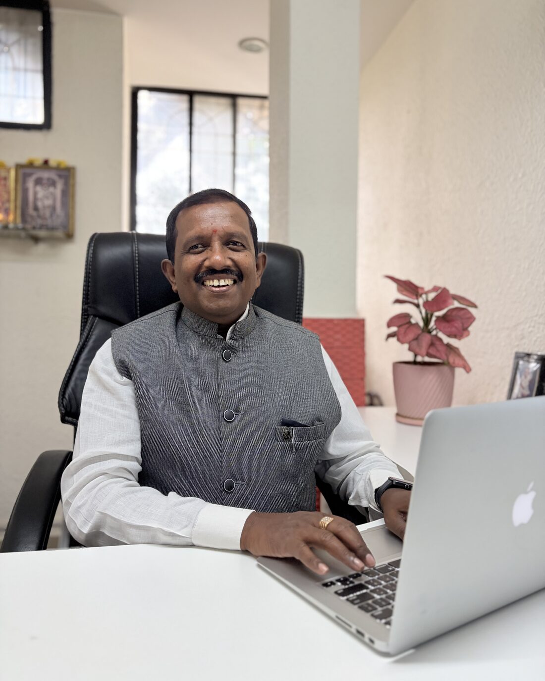 Venkatachalapathi T, Founder of Sharadha Investments Services, at his desk in the Bengaluru office
